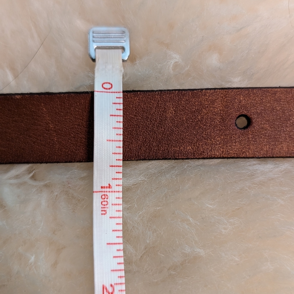 Thin brown leather belt